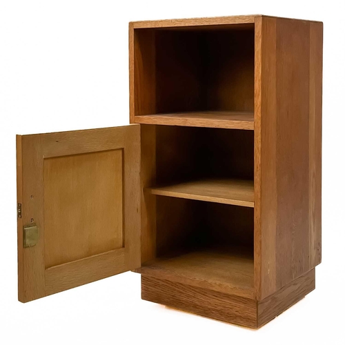 83 - Gordon Russell (1892-1980) A pair of oak bedside cabinets with an open shelf above a single cupboard... 