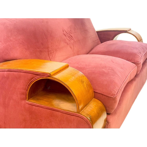 85 - An Art Deco walnut veneer upholstered three piece suite. Comprising: a three seater and two armchair... 