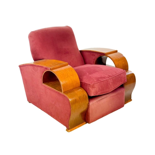 85 - An Art Deco walnut veneer upholstered three piece suite. Comprising: a three seater and two armchair... 