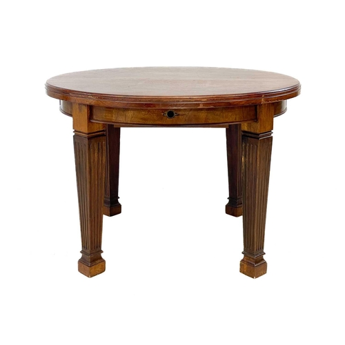 92 - A late Victorian oval mahogany extending dining table. Fitted with two additional leaves, on fluted ... 