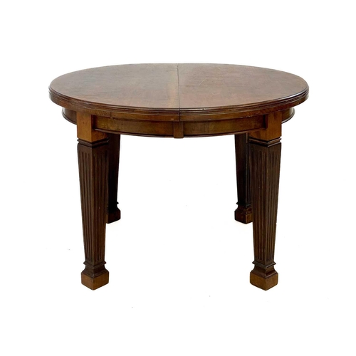 92 - A late Victorian oval mahogany extending dining table. Fitted with two additional leaves, on fluted ... 