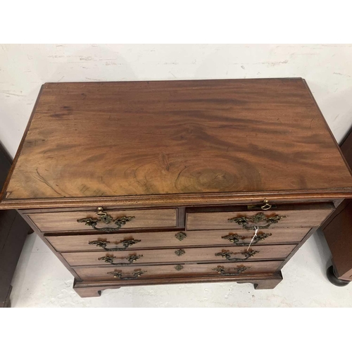 96 - A George III mahogany small chest. Fitted a brushing slide above two short and three long drawers wi... 