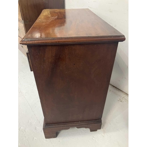 96 - A George III mahogany small chest. Fitted a brushing slide above two short and three long drawers wi... 