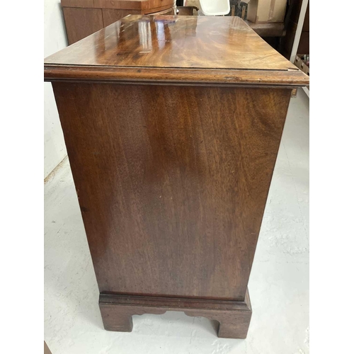 96 - A George III mahogany small chest. Fitted a brushing slide above two short and three long drawers wi... 