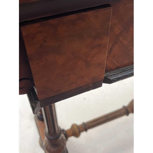 99 - A Victorian burr walnut and ebonised fold over swivel top card table. The top of rectangular form wi... 