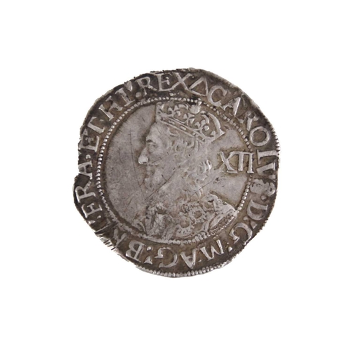 104 - Charles I shilling 1639/40 Coin has good detail both sides, mint mark triangle, slight edge nibbles.