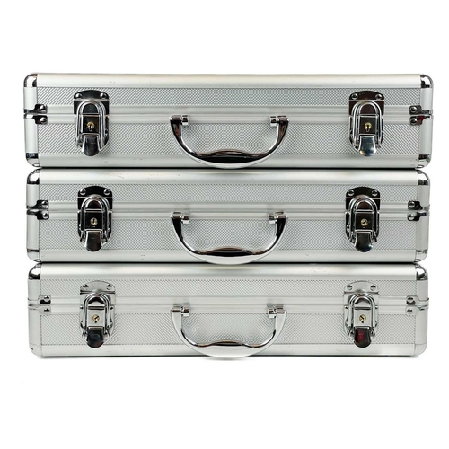 197 - Lockable coin cases (x3) Comprising three aluminium coin cases each with approx. five coin trays wit... 