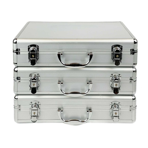 197 - Lockable coin cases (x3) Comprising three aluminium coin cases each with approx. five coin trays wit... 