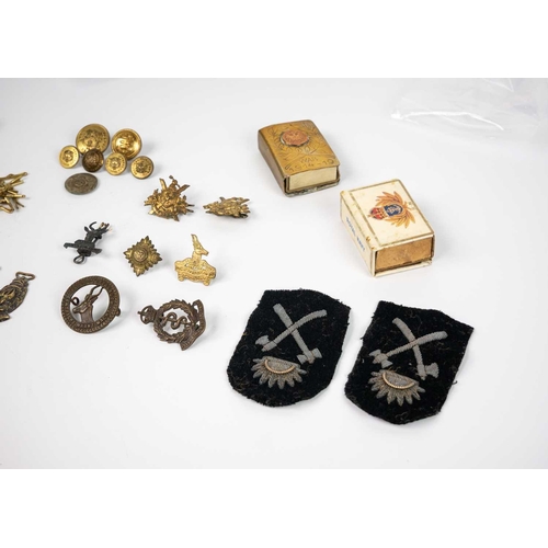 213 - Military badges, buttons, Trench Art etc Comprising: 1: Six military badges from South Africa 2: 191... 