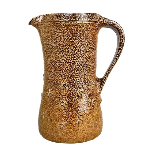 128 - Bernard LEACH (1887-1979) A mediaeval style jug, brown speckled salt glaze with thumbnail decoration... 