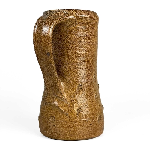 128 - Bernard LEACH (1887-1979) A mediaeval style jug, brown speckled salt glaze with thumbnail decoration... 