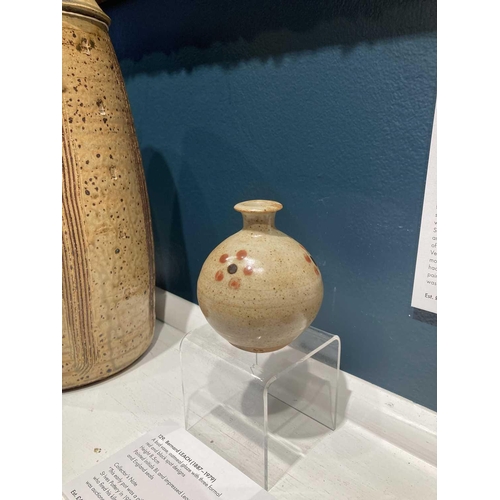 129 - Bernard LEACH (1887-1979) A bud vase, oatmeal glaze with three formal red and black spot designs Hei... 