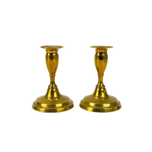 121 - A pair of 19th century brass candlesticks. With faceted knop, height 24cm together with four other p... 