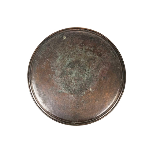 122 - An Arts and Crafts copper charger by Hugh Wallis. A central rampant lion with oak leaf and acorn bor... 