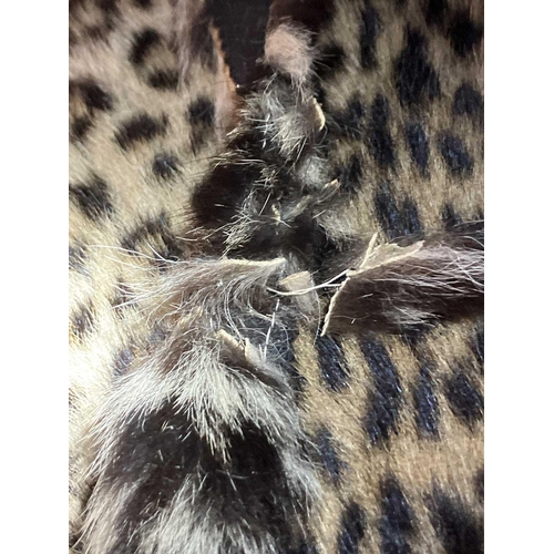 124 - An early 20th century Leopard skin rug. With head mount and mouth agape backed onto felt, length 196... 