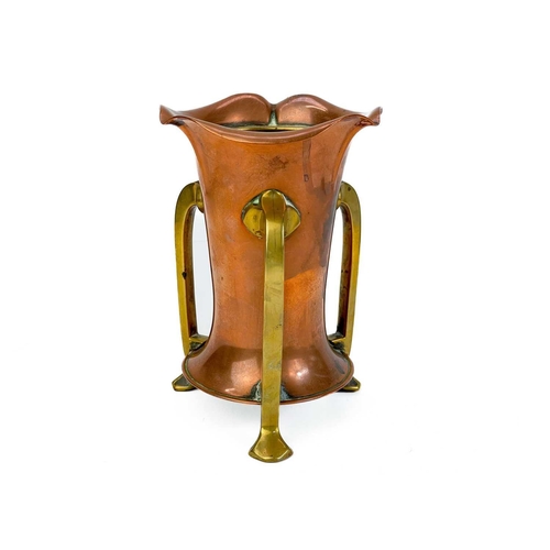 125 - A copper chamberstick by Henry Loveridge. Diameter 18cm, together with an Art Nouveau copper and bra... 