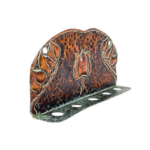 125 - A copper chamberstick by Henry Loveridge. Diameter 18cm, together with an Art Nouveau copper and bra... 