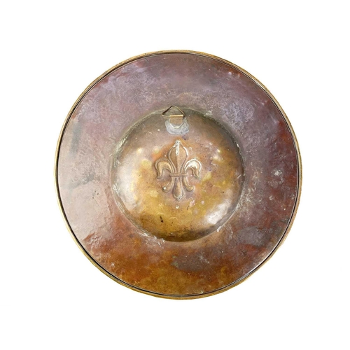 128 - A large brass circular alms dish. With central gadrooned decoration, diameter 41.5cm together with t... 