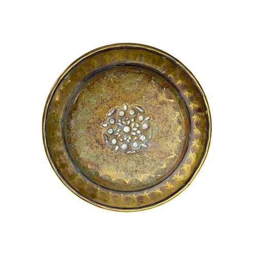128 - A large brass circular alms dish. With central gadrooned decoration, diameter 41.5cm together with t... 