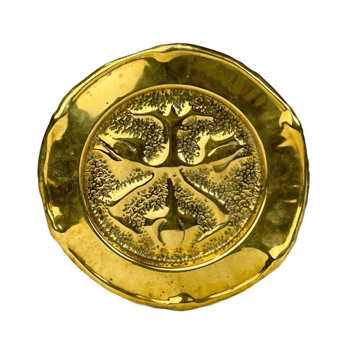 128 - A large brass circular alms dish. With central gadrooned decoration, diameter 41.5cm together with t... 