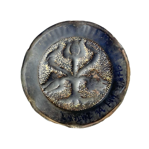 128 - A large brass circular alms dish. With central gadrooned decoration, diameter 41.5cm together with t... 