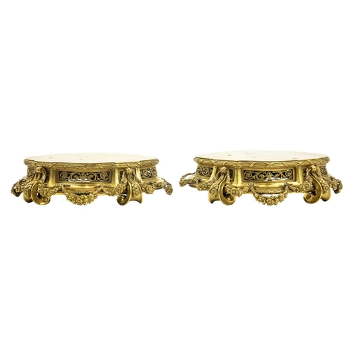 129 - A pair of neo-classical French ormolu, shaped base mounts. With foliate pierced panels below a reed ... 
