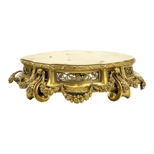 129 - A pair of neo-classical French ormolu, shaped base mounts. With foliate pierced panels below a reed ... 