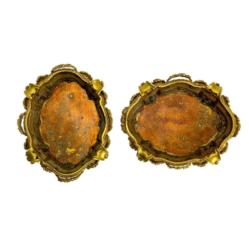 129 - A pair of neo-classical French ormolu, shaped base mounts. With foliate pierced panels below a reed ... 