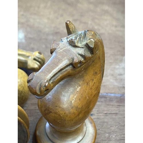 130 - An ebony and boxwood Staunton pattern chess set. Height of king 8.5cm, together with a folding chess... 