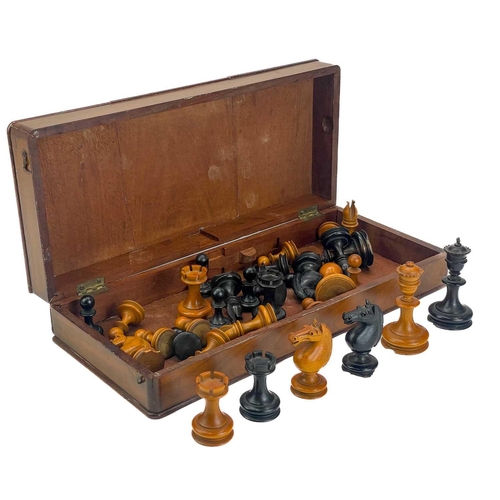 130 - An ebony and boxwood Staunton pattern chess set. Height of king 8.5cm, together with a folding chess... 