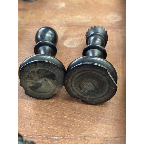 130 - An ebony and boxwood Staunton pattern chess set. Height of king 8.5cm, together with a folding chess... 