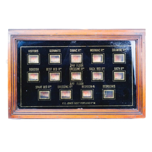 137 - An Edwardian servant's bell indicator board. By F C Jones, Gt Portland St W. With 14 labelled window... 