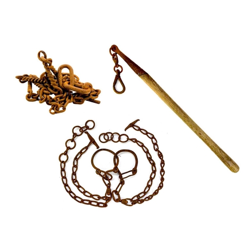 139 - An iron horse tether chain. Together with a pair of livestock hobbles and bull leader. (3)