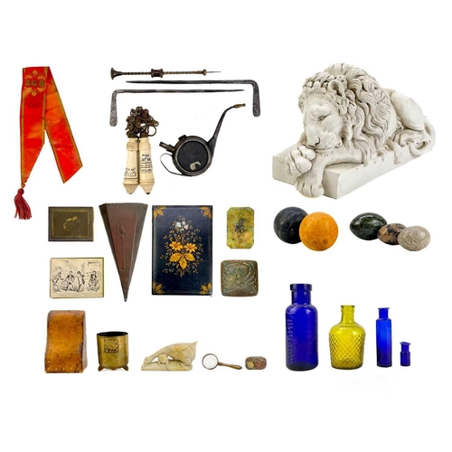 140 - A plaster sculpture of a Sleeping Lion, after Canova. Height 15cm, length 31.5cm, together with a pr... 