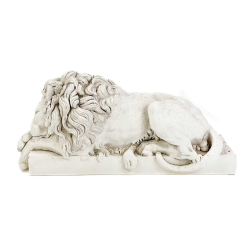 140 - A plaster sculpture of a Sleeping Lion, after Canova. Height 15cm, length 31.5cm, together with a pr... 