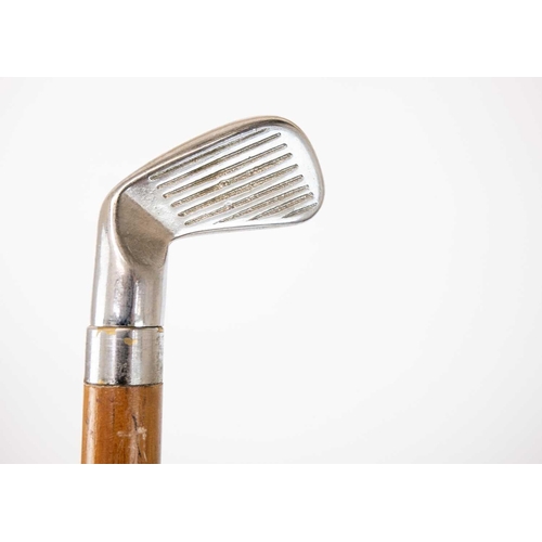 143 - A collection of eleven walking canes and umbrellas. One with silver mount, tallest 94cm.(11)