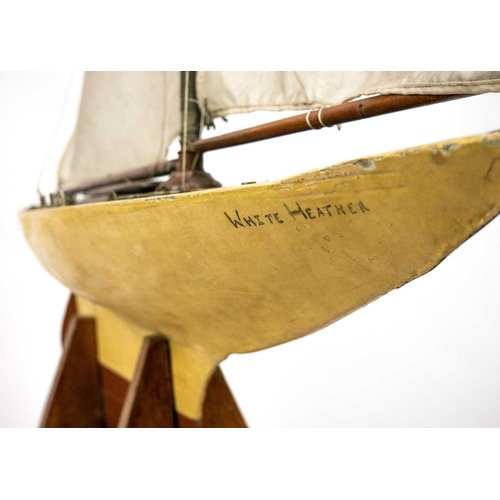 144 - An early 20th century pond yacht White Heather. With stand, height 125cm.