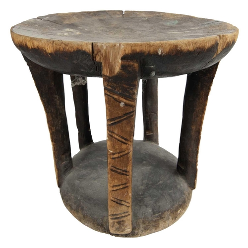 145 - A carved and pierced stone screen & an African stool. The property of Peter Hone. The screen 33cm x ... 