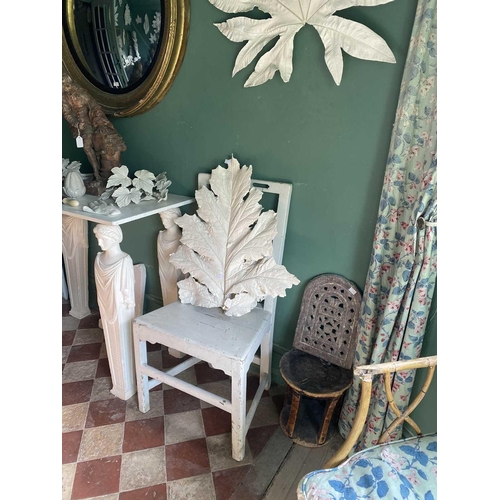 145 - A carved and pierced stone screen & an African stool. The property of Peter Hone. The screen 33cm x ... 