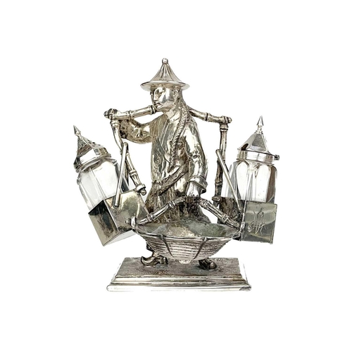 148 - A Mappin & Webb silver plated novelty condiment set. Modelled as an oriental man with a yoke and bas... 