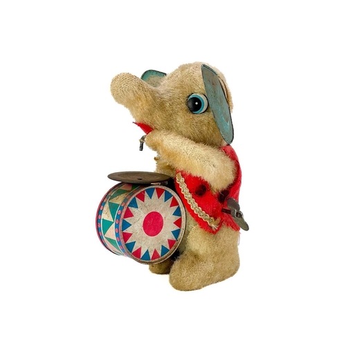 157 - A carved wood automaton in the form of a seated whipped with 'beating' heart. Height 13cm, together ... 