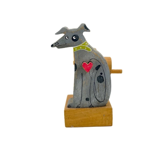 157 - A carved wood automaton in the form of a seated whipped with 'beating' heart. Height 13cm, together ... 