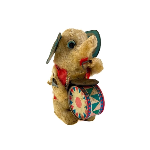 157 - A carved wood automaton in the form of a seated whipped with 'beating' heart. Height 13cm, together ... 