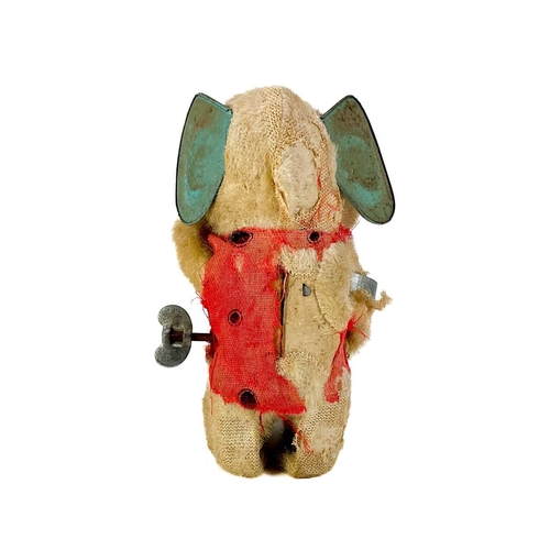 157 - A carved wood automaton in the form of a seated whipped with 'beating' heart. Height 13cm, together ... 