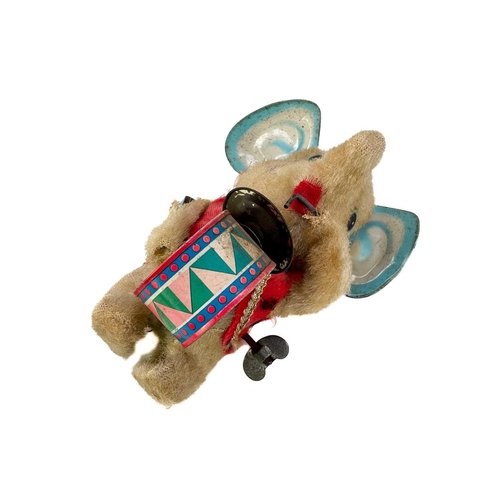 157 - A carved wood automaton in the form of a seated whipped with 'beating' heart. Height 13cm, together ... 