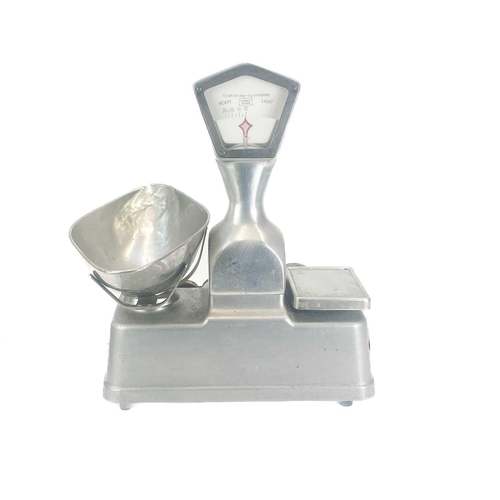 158 - A set of Vandome and Hart Ltd of London aluminium shop scales. With five weights. Height 46cm.