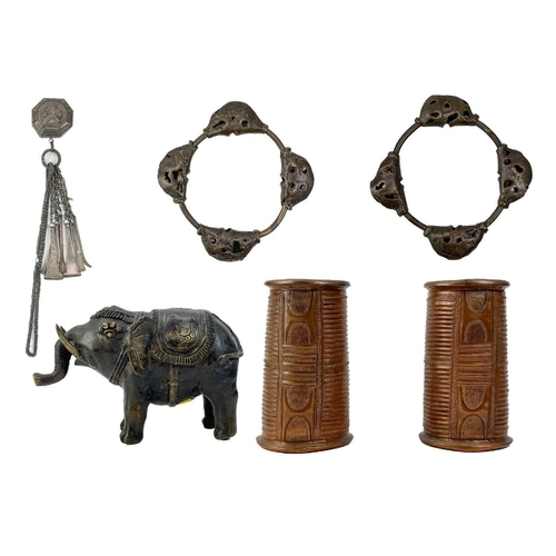 160 - A white metal betel nut box. Length 6cm together with a pair of African cuff bracelets, an Indian br... 