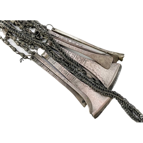 160 - A white metal betel nut box. Length 6cm together with a pair of African cuff bracelets, an Indian br... 