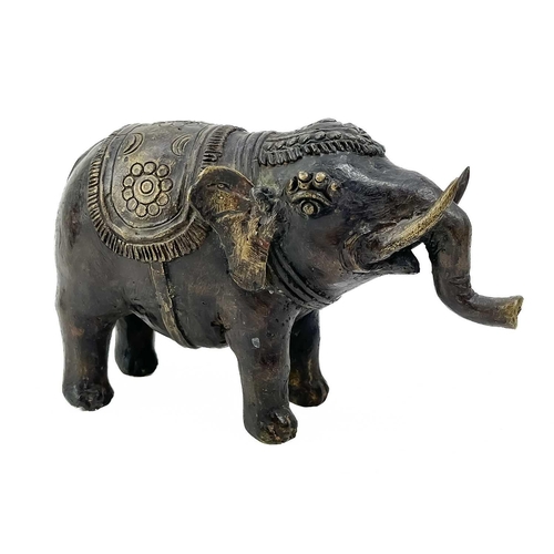 160 - A white metal betel nut box. Length 6cm together with a pair of African cuff bracelets, an Indian br... 