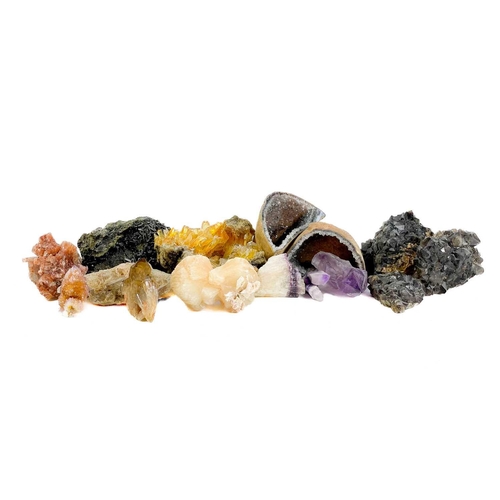 165 - A collection of minerals. To include several large quartz points, a quartz geode, amethyst, and seve... 